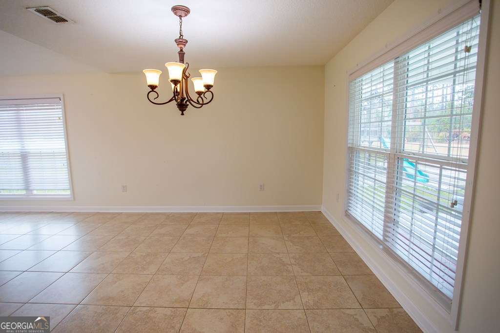 99 Jennifer Lane Baxley, GA 31513 - Photo 29 of 48 a view of an empty room with a window
