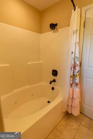a bathroom with a granite countertop sink mirror and a