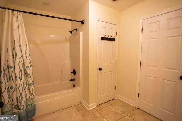 a bathroom with a shower and a bathtub
