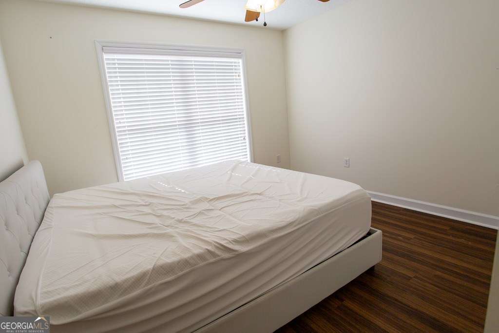 99 Jennifer Lane Baxley, GA 31513 - Photo 47 of 48 a bed sitting in a bedroom next to a window