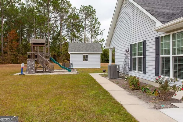 a front view of a house with garden