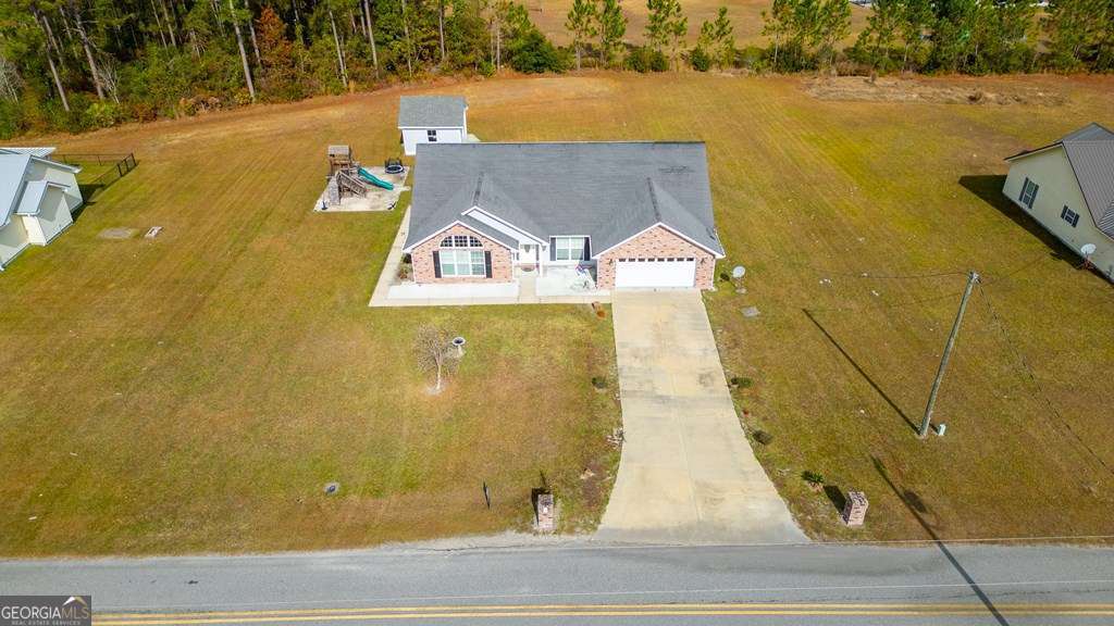 99 Jennifer Lane Baxley, GA 31513 - Photo 10 of 48 an aerial view of a house with a yard