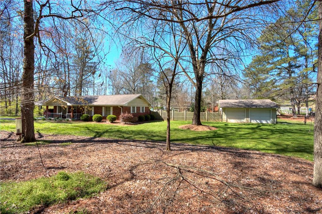 3 Cinnamon Lane Northeast Rome, GA 30161 - Photo 1 of 1 a view of a house with a yard and large trees
