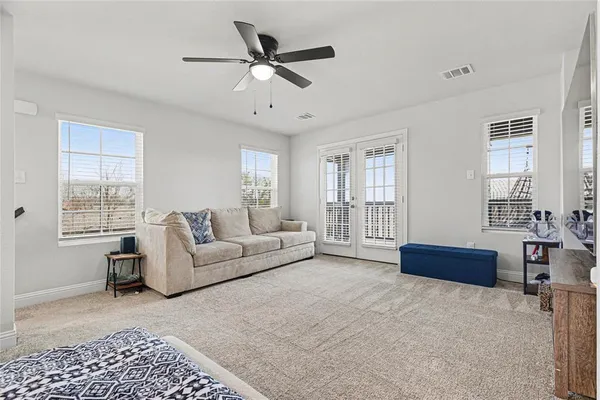 a living room with furniture and a window
