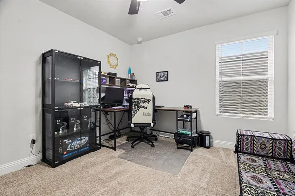 a bedroom with furniture and a window