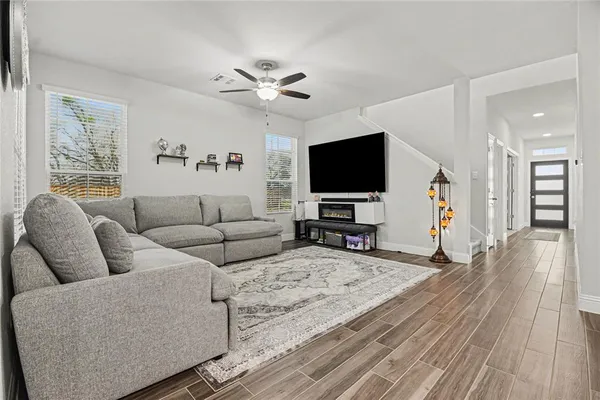 a living room with furniture and a flat screen tv