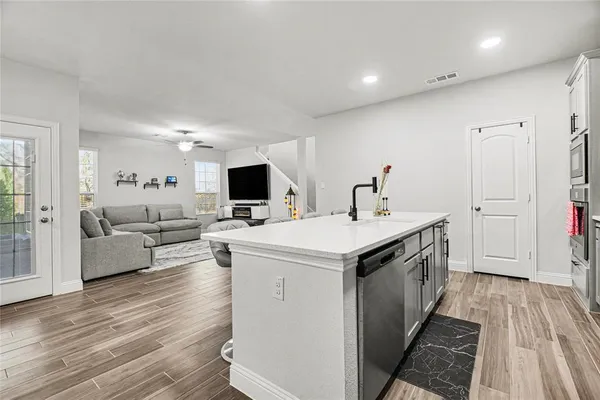 a view of living room with furniture and flat screen tv