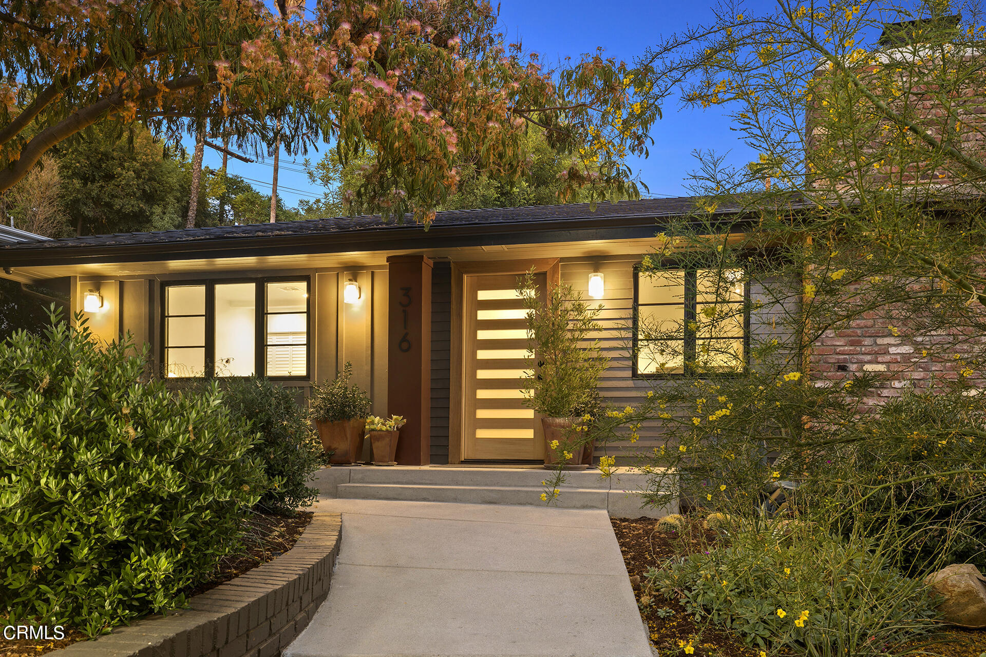 316 Glenullen Drive Pasadena, CA 91105 - Photo 2 of 43 a front view of a house with a yard
