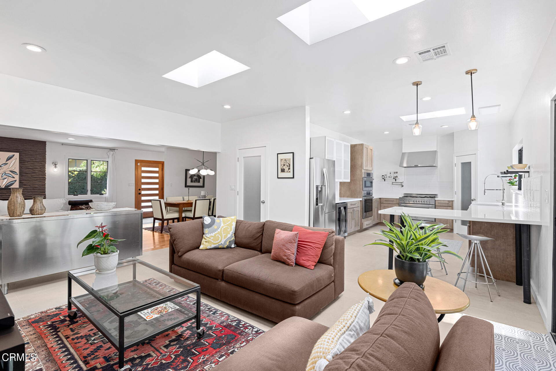 316 Glenullen Drive Pasadena, CA 91105 - Photo 13 of 43 a living room with furniture flowerpot and a chandelier
