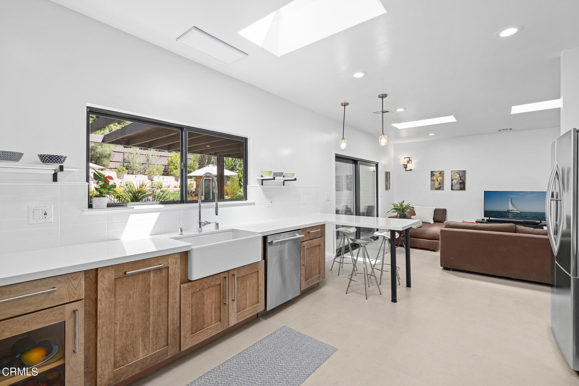 316 Glenullen Drive Pasadena, CA 91105 - Photo 14 of 43 a kitchen with a sink stove and wooden cabinets