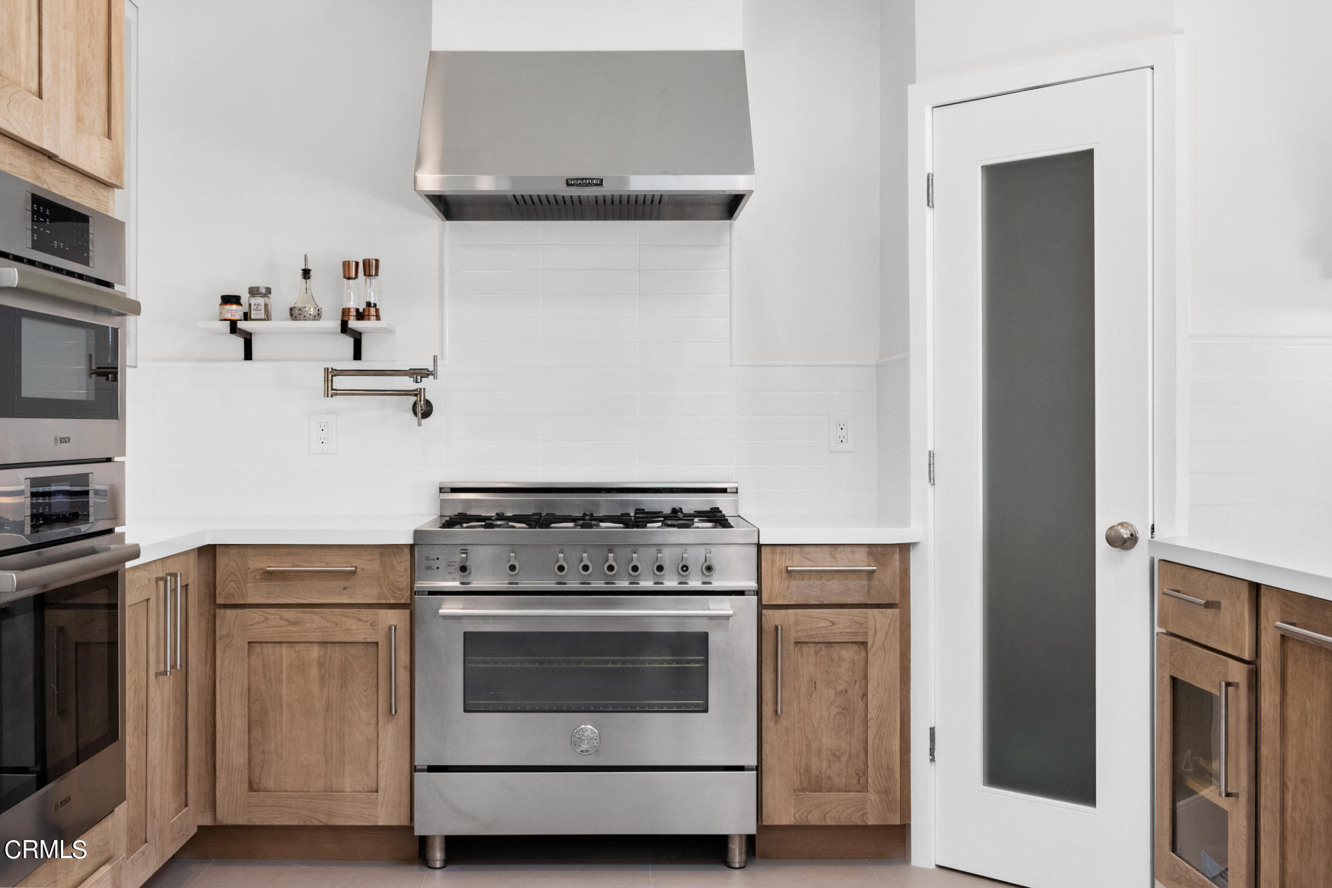 316 Glenullen Drive Pasadena, CA 91105 - Photo 16 of 43 a kitchen with cabinets and steel appliances