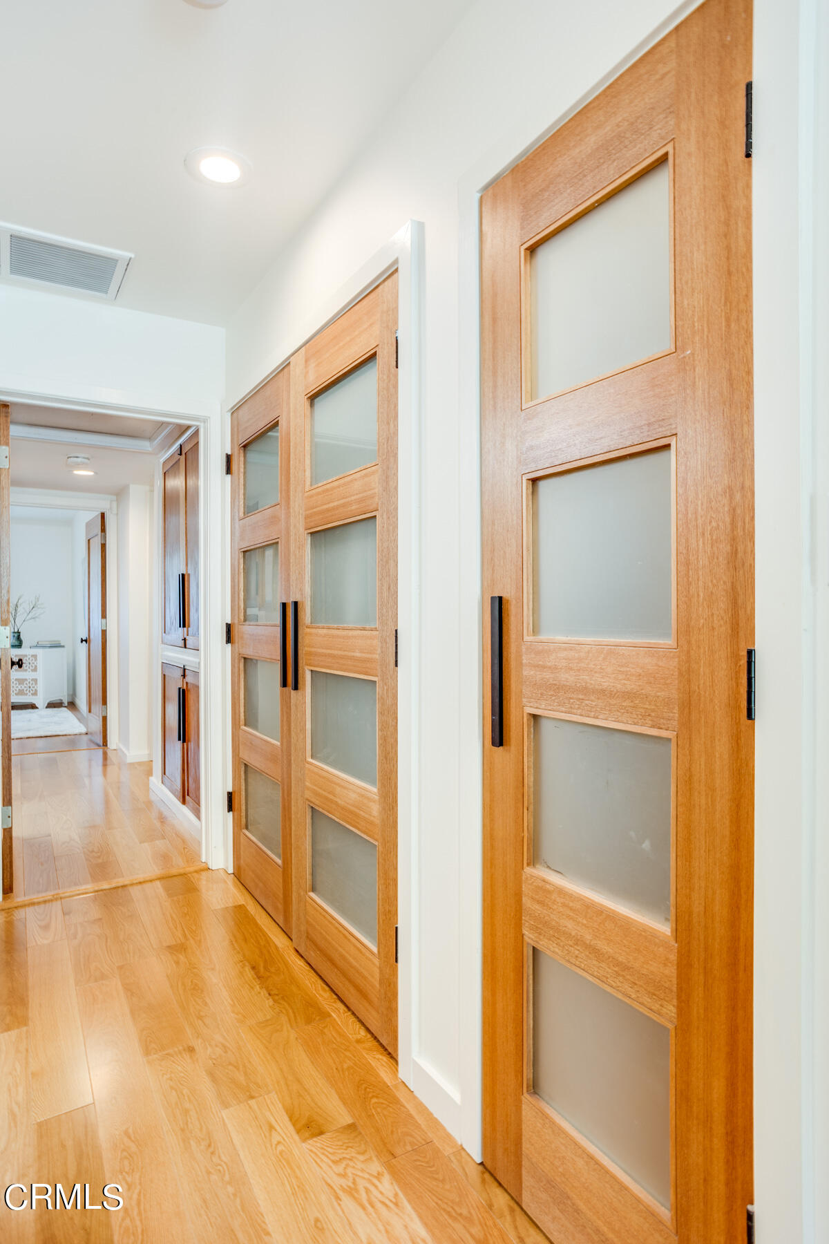 316 Glenullen Drive Pasadena, CA 91105 - Photo 18 of 43 a view of a hallway with wooden floor and closet