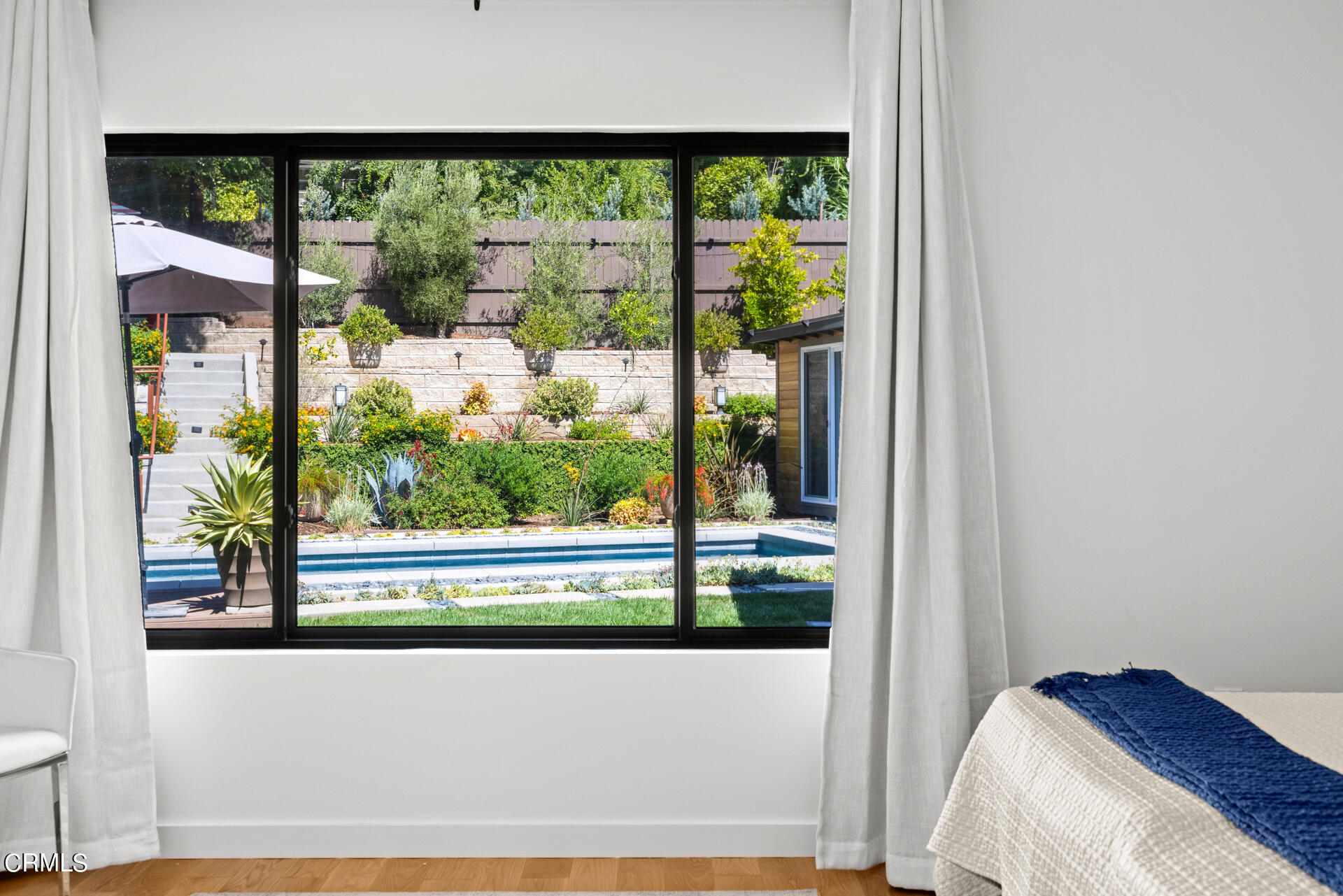 316 Glenullen Drive Pasadena, CA 91105 - Photo 24 of 43 a view of bedroom with a bed and a window