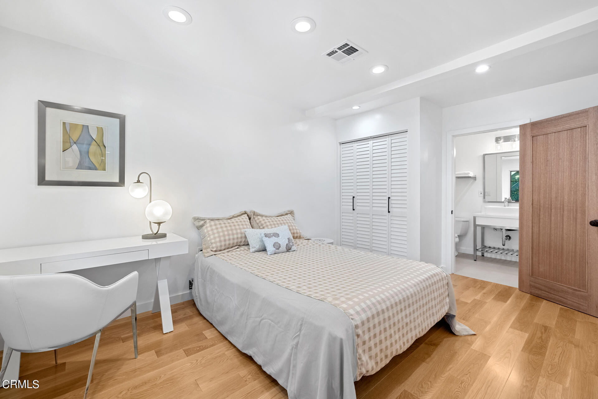 316 Glenullen Drive Pasadena, CA 91105 - Photo 27 of 43 a bedroom with a bed and a table