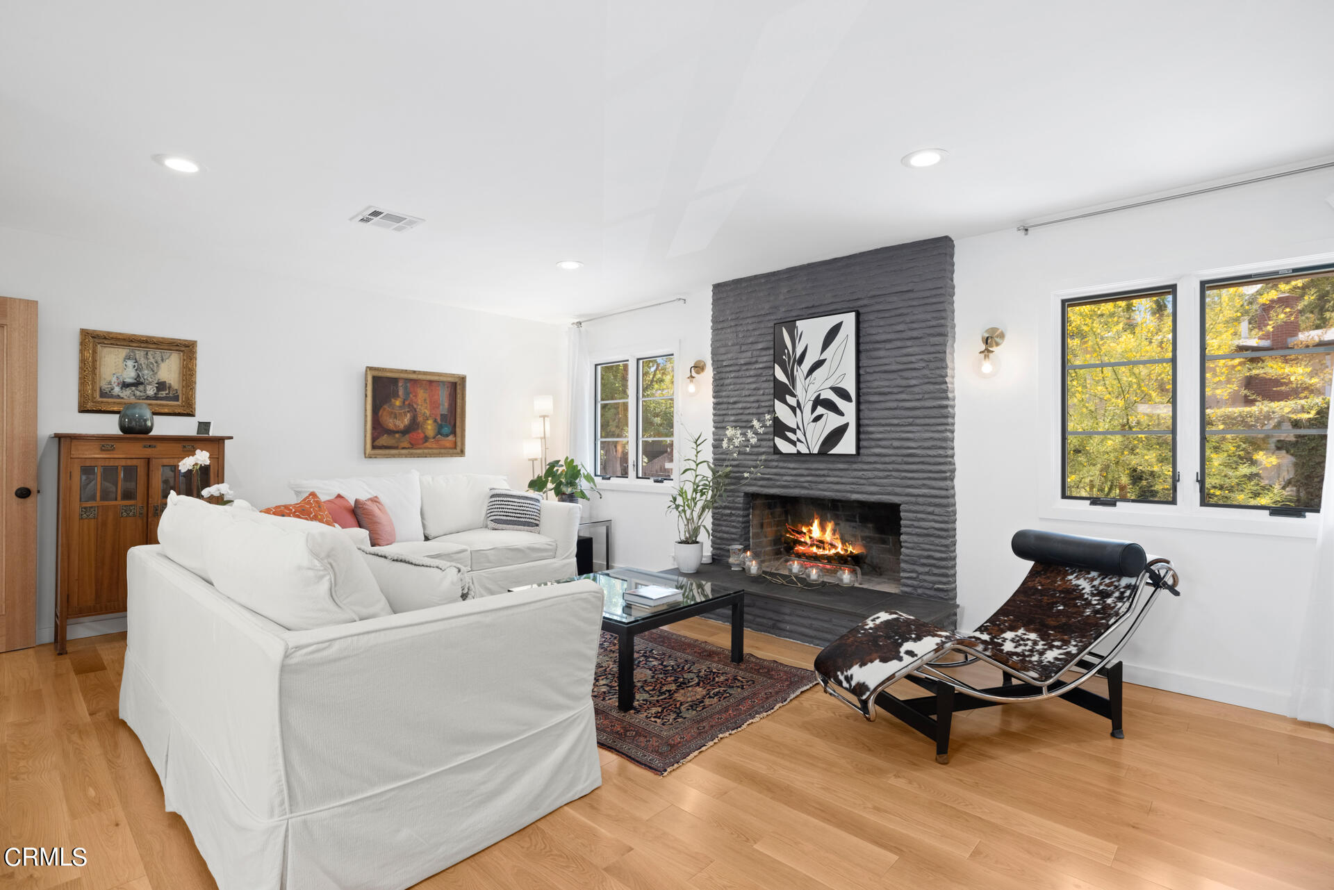 316 Glenullen Drive Pasadena, CA 91105 - Photo 8 of 43 a living room with furniture and a fireplace
