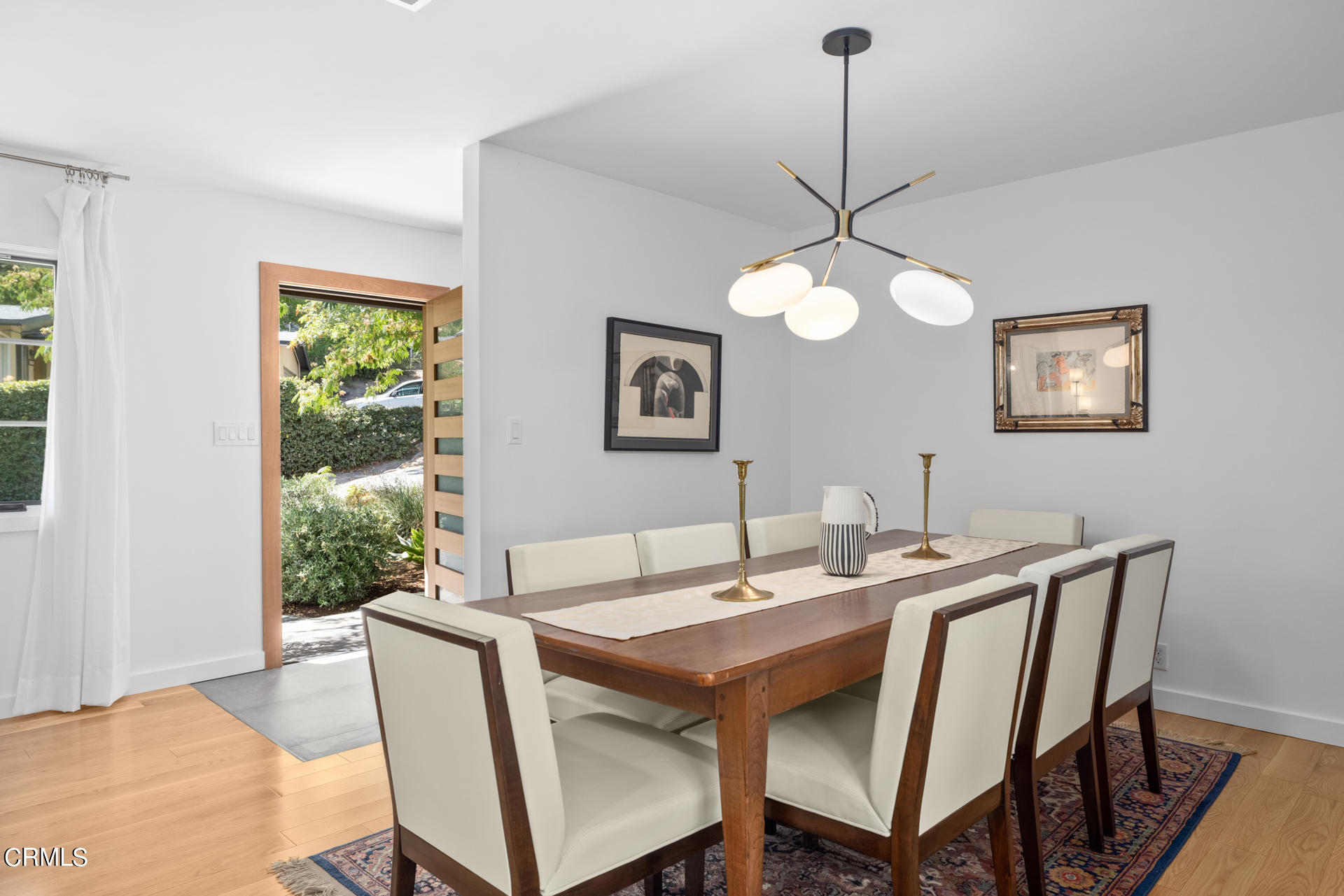 316 Glenullen Drive Pasadena, CA 91105 - Photo 9 of 43 a view of a dining room with a table and chairs