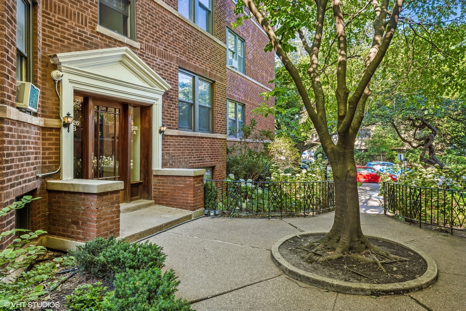 526 Sheridan Road, Unit 1B Evanston, IL 60202 - Photo 2 of 18 a front view of a house with a fountain