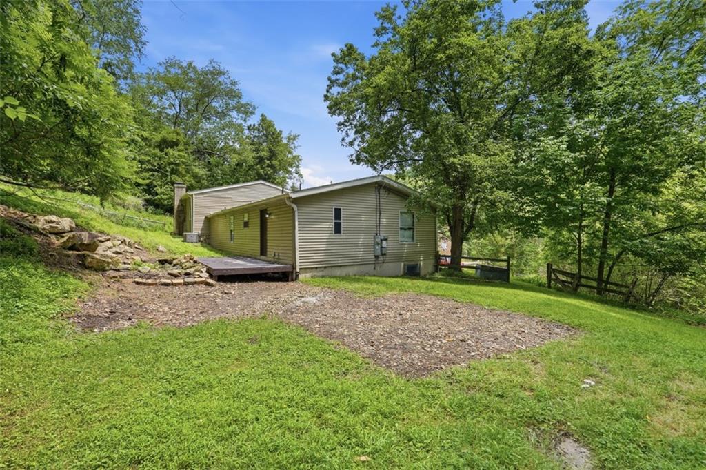 8517 Wittmer Road Pittsburgh, PA 15237 - Photo 40 of 46 a view of a backyard with a barn and large trees