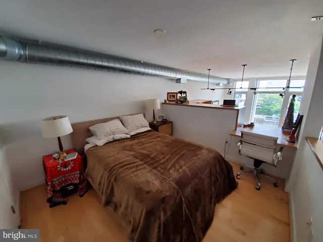 a bed room with a bed and furniture