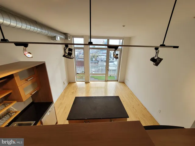 a view of walk in closet with clothes