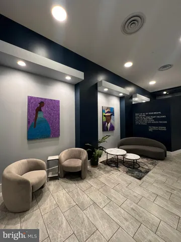 a view of a brick house with potted plants