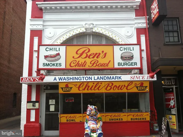 a sign on the side of a street