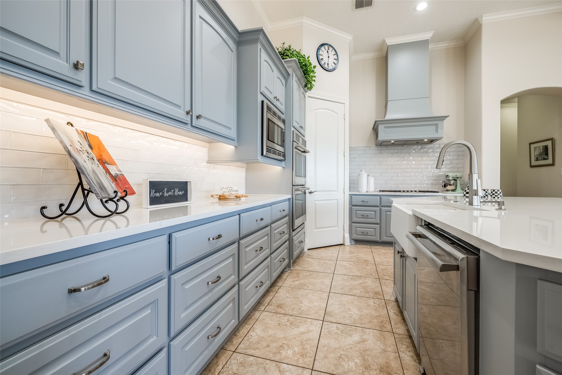 31102 Lower Oxbow Trace Fulshear, TX 77441 - Photo 12 of 50 Recently remodeled gorgeous Chef's Kitchen with lots of cabinets, quartz counters, new 5 gas burner, double ovens, microwave, breakfast bar, large pantry, arch through to secondary bedrooms