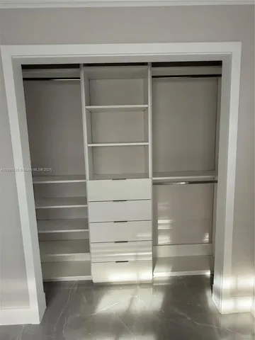 a empty closet with white paint