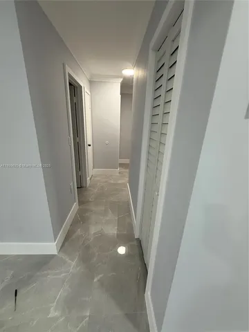 a view of hallway with windows