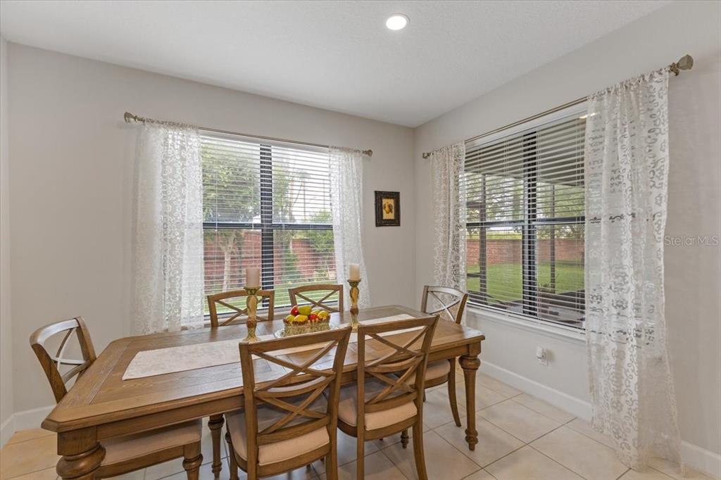 7180 Beek Street Windermere, FL 34786 - Photo 4 of 33 a dining room with furniture and window