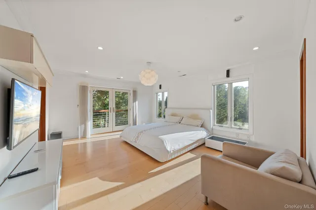 a view of a bathroom with a tub sink and a mirror