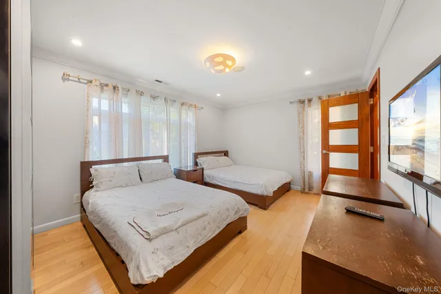 a view of an empty room with window and stairs