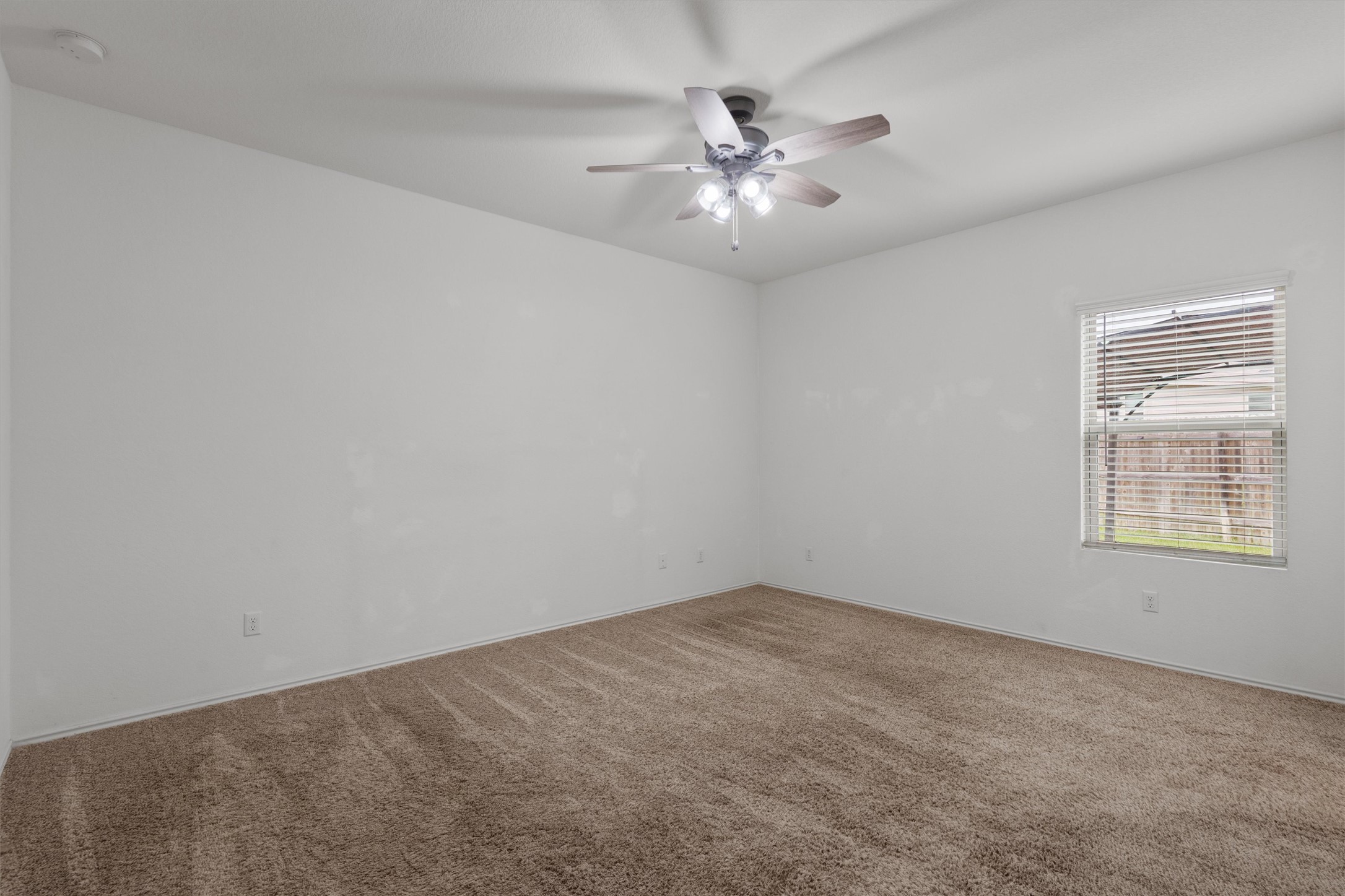 791 Circle Way Jarrell, TX 76537 - Photo 15 of 36 Neutral wall tones with a window featuring horizontal blinds