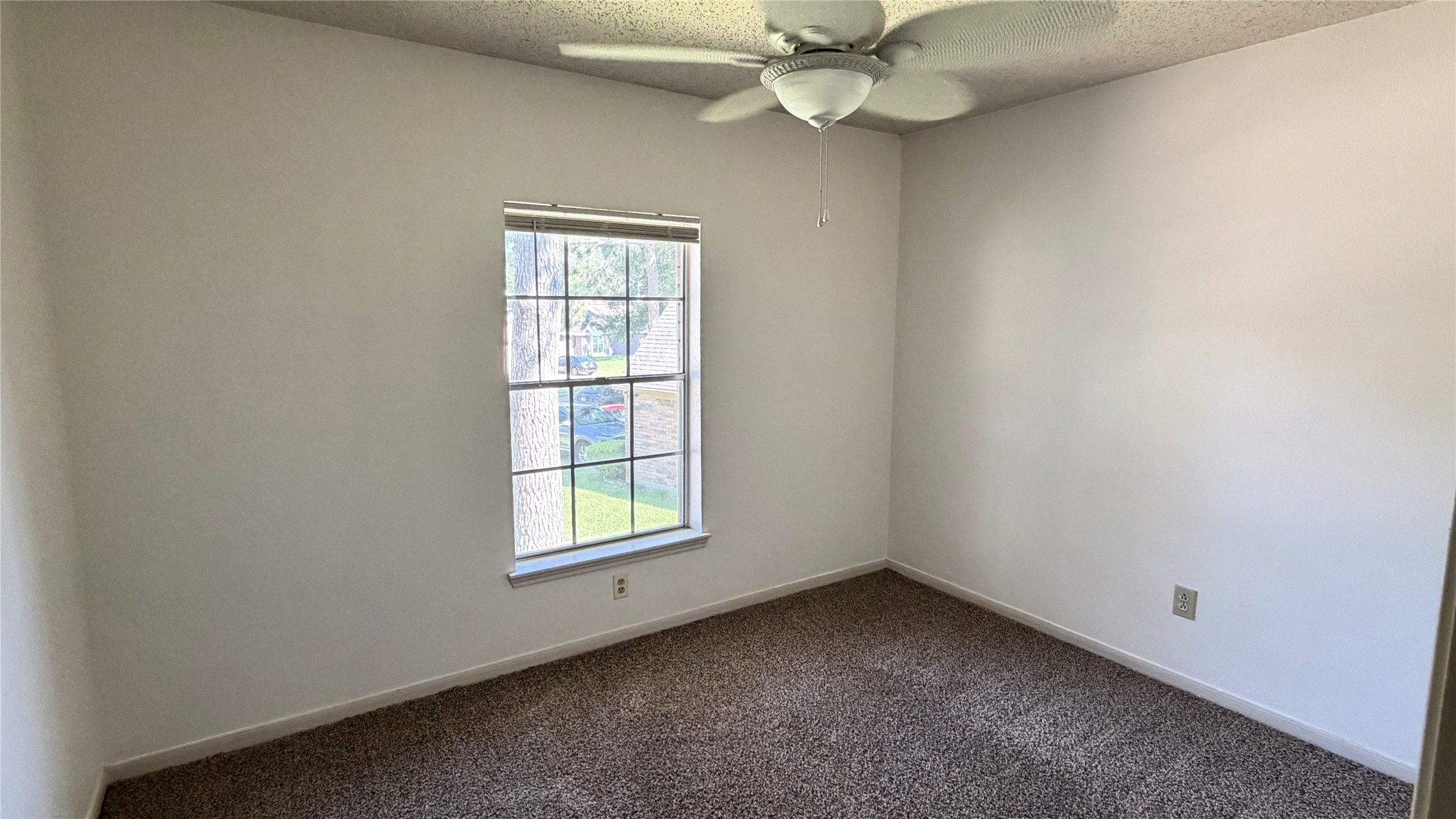 7771 Springville Drive Houston, TX 77095 - Photo 12 of 13 Spacious bedroom featuring a large closet and cozy layout.