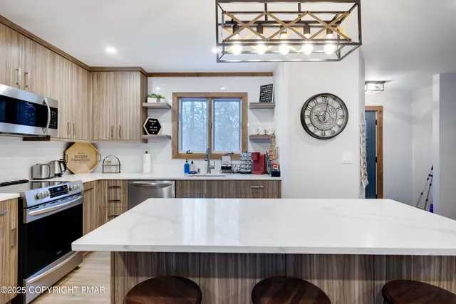 a kitchen with a table and chairs