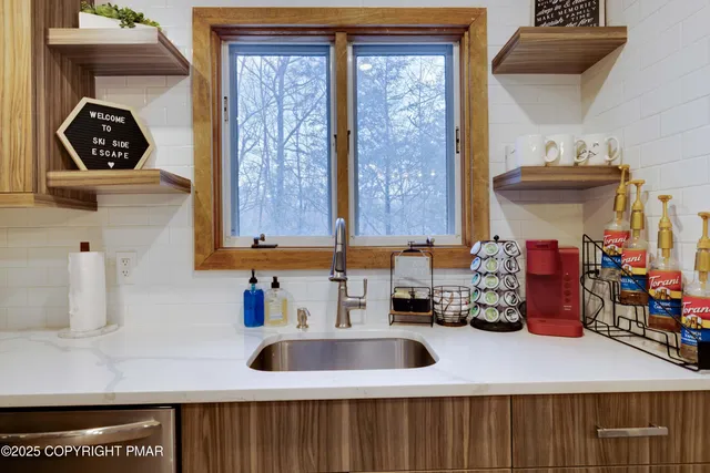 a kitchen with a refrigerator and a stove
