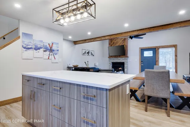 a view of living room with furniture and a chandelier