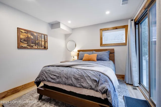 a bedroom with a bed and a television