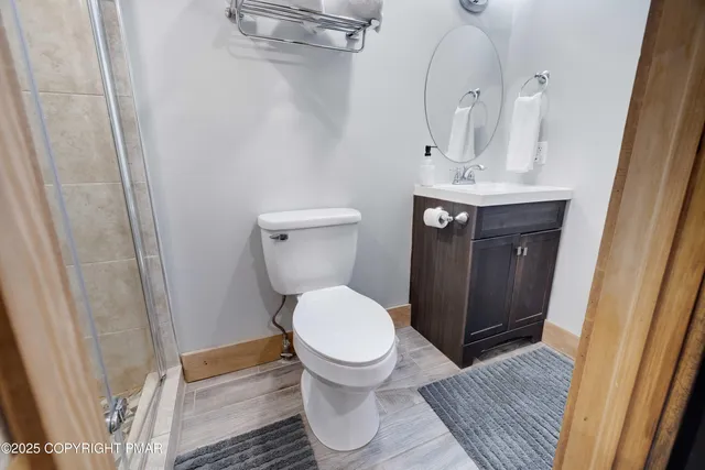 a picture of a bench in front of a wall