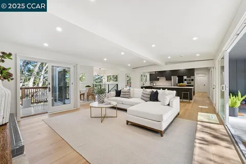 a living room with furniture and a table