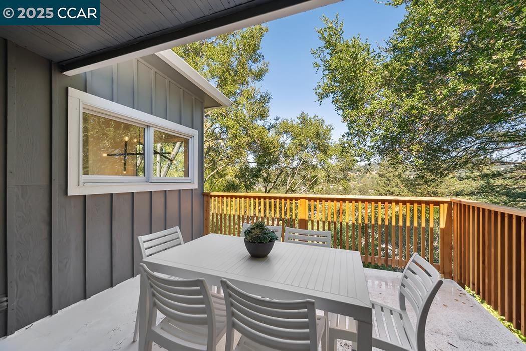 26 Berkeley Avenue Orinda, CA 94563 - Photo 14 of 28 a view of a balcony with table and chairs