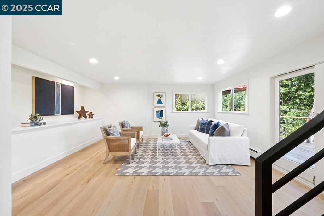 26 Berkeley Avenue Orinda, CA 94563 - Photo 21 of 28 a living room with furniture and a large window