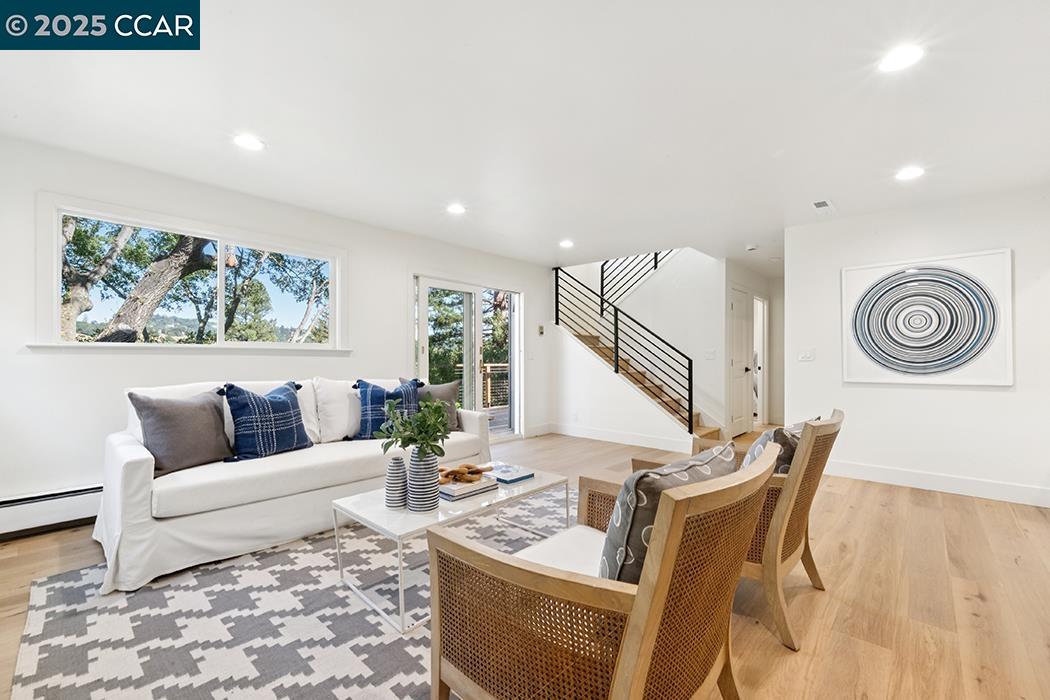26 Berkeley Avenue Orinda, CA 94563 - Photo 24 of 28 a living room with furniture and a wooden floor