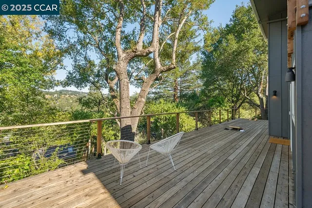 a view of a balcony with wooden floor