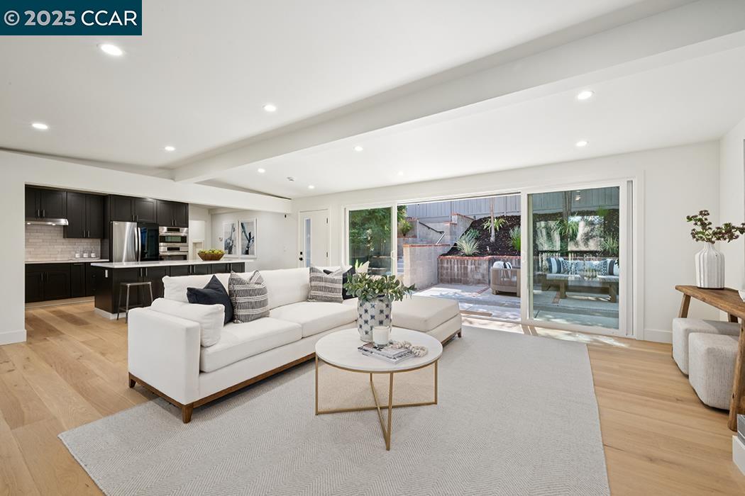 26 Berkeley Avenue Orinda, CA 94563 - Photo 5 of 28 a living room with furniture and a large window