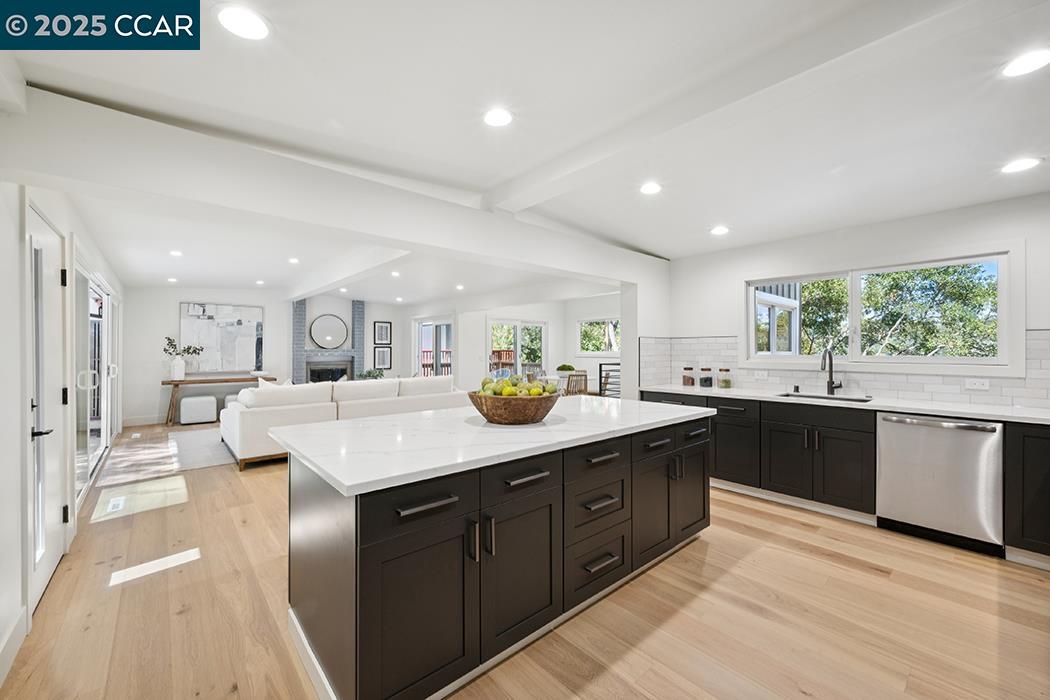 26 Berkeley Avenue Orinda, CA 94563 - Photo 10 of 28 a kitchen with counter top space sink and center island