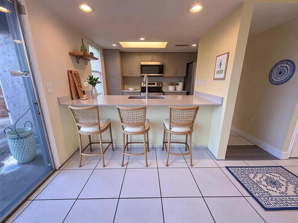 4033 Henley Road, Unit 1707 Orlando, FL 32839 - Photo 7 of 66 a dining hall with a dining table and chairs