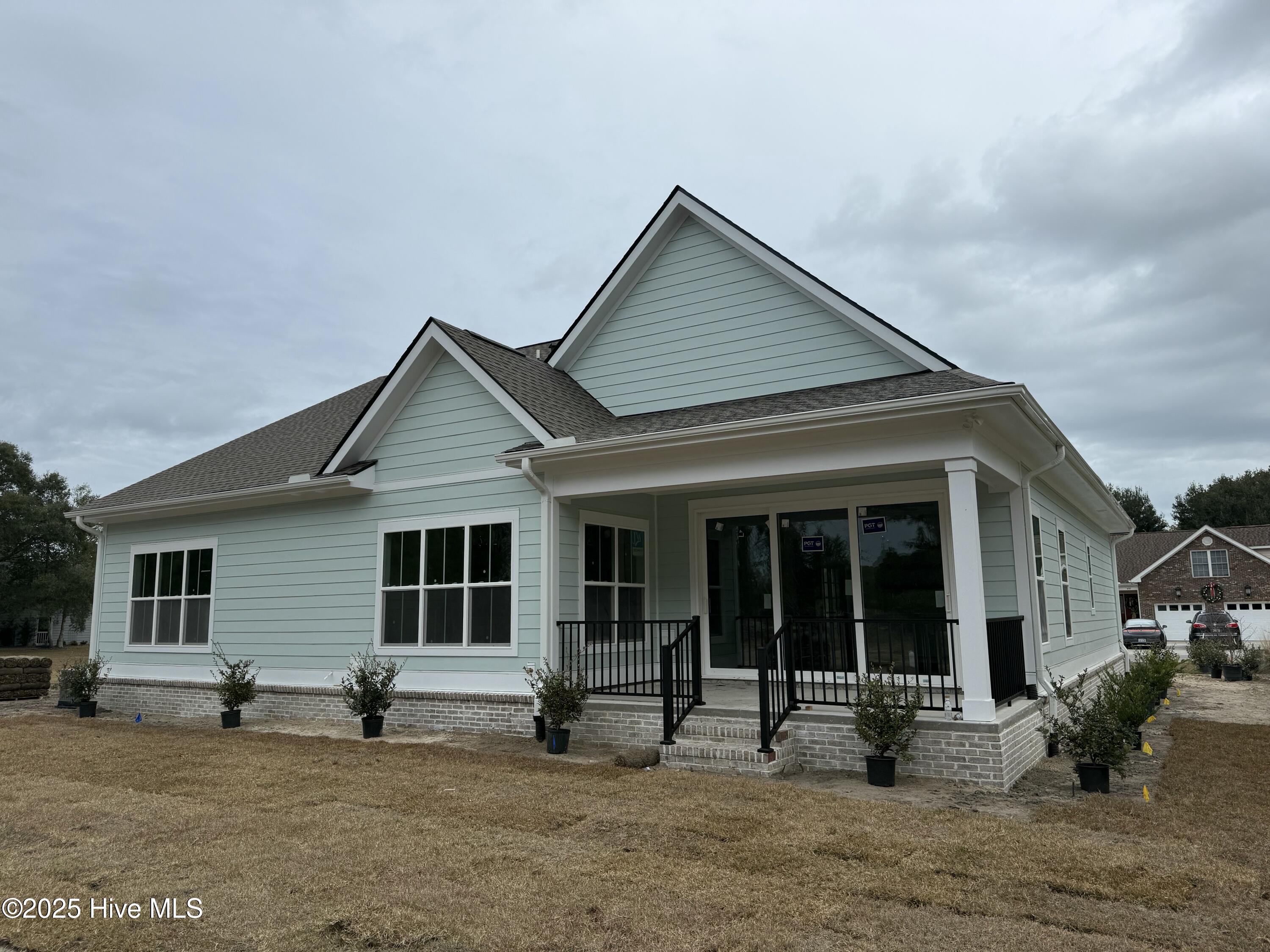 498 Genoe's Point Road Southwest Supply, NC 28462 - Photo 2 of 34 Private backyard covered porch