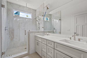 498 Genoe's Point Road Southwest Supply, NC 28462 - Photo 31 of 34 Huge Tiled Primary shower and double sinks