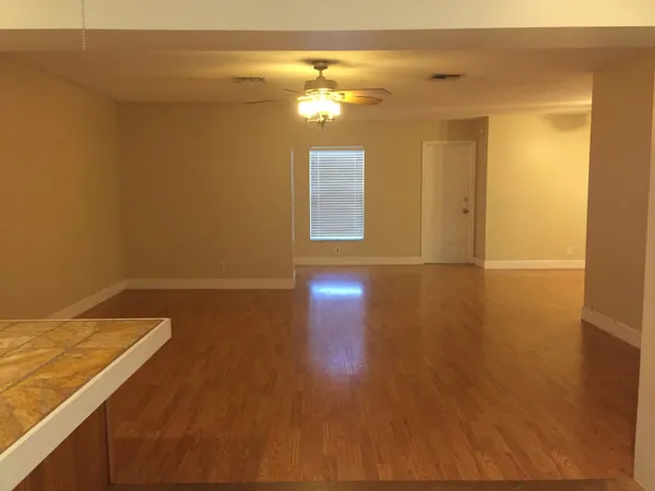 a view of a livingroom with wooden floor